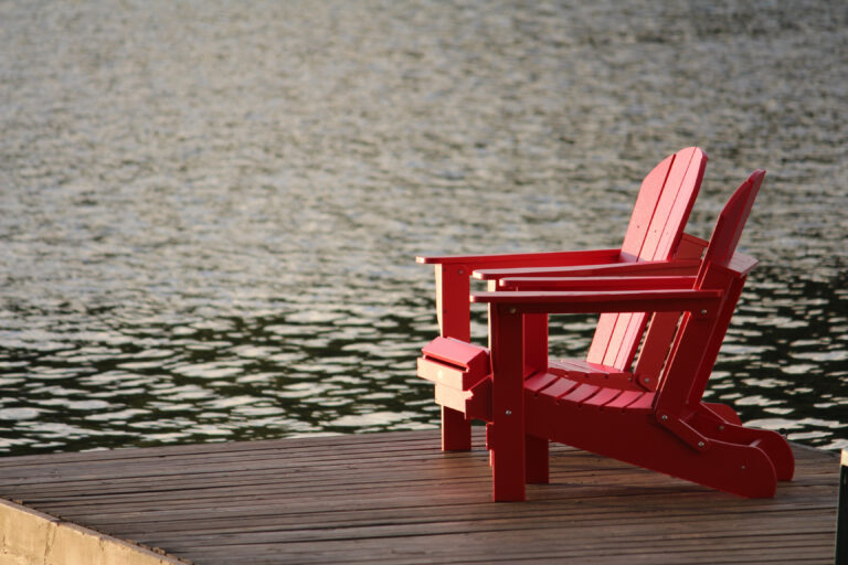 Chairs by lake