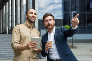 Business partners discussing ideas in front of a modern building