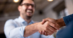 DMLO-man-shaking-hand